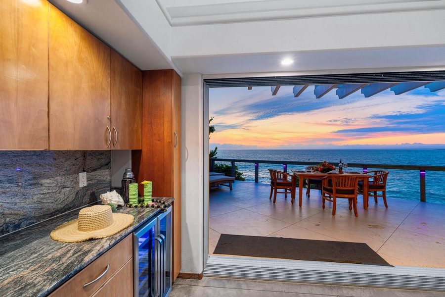 Ocean breezes flow through the open-air kitchen and dining area for true indoor-outdoor living.