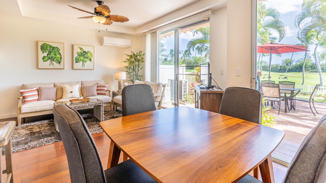 Plenty of seating and natural lighting in this seamless living and dining area.