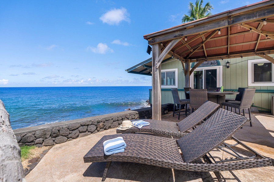 Relax in shaded comfort while taking in the sights and sounds of the ocean.