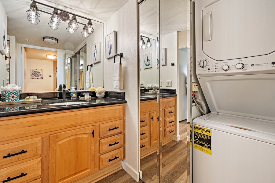 The bathroom is equipped with modern fixtures and offers the convenience of an in-unit washer and dryer.