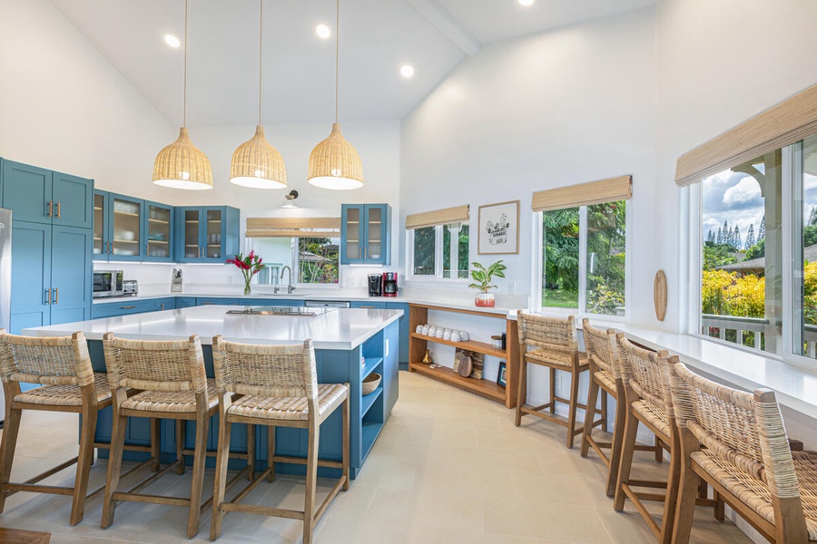 Modern kitchen with new appliances and bar seating.