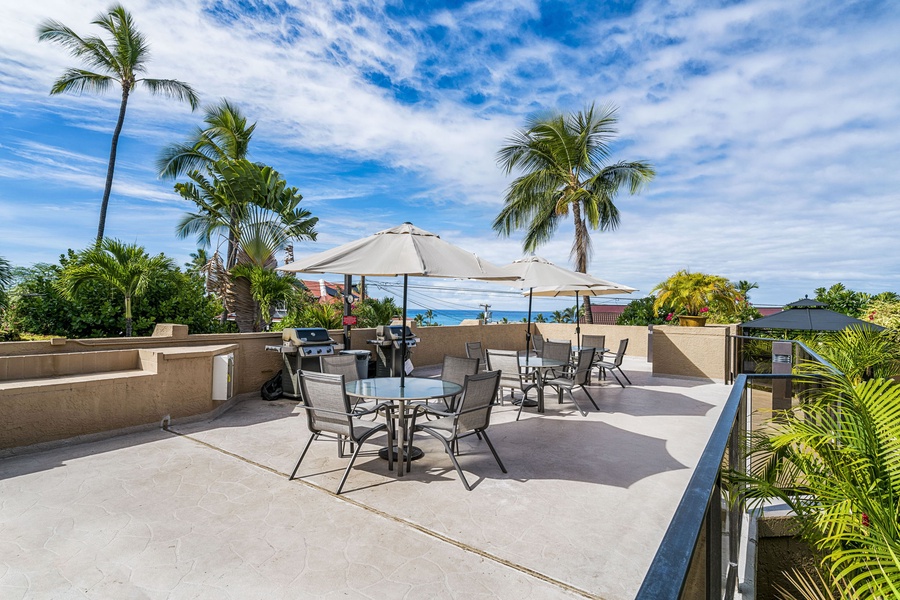 Rooftop terrace with shaded seating and panoramic views.
