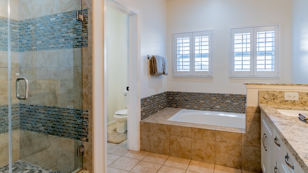 The primary guest bathroom featuring a walk-in shower.