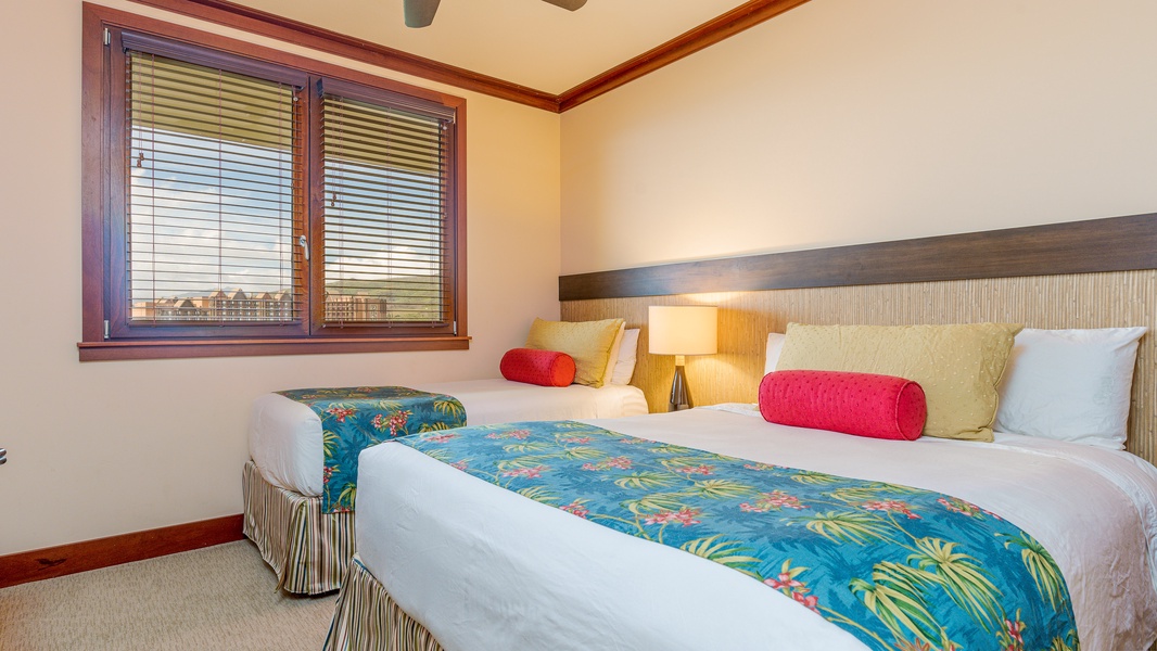 The second guest bedroom with bright tropical patterns and soft lighting.