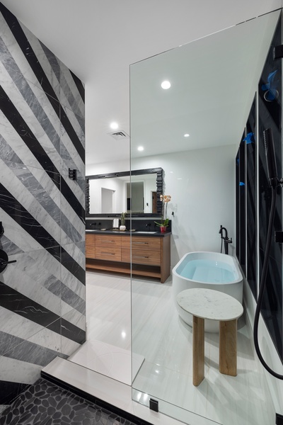 Pamper yourself in a spa-like ensuite with dual vanities and contemporary island luxury.