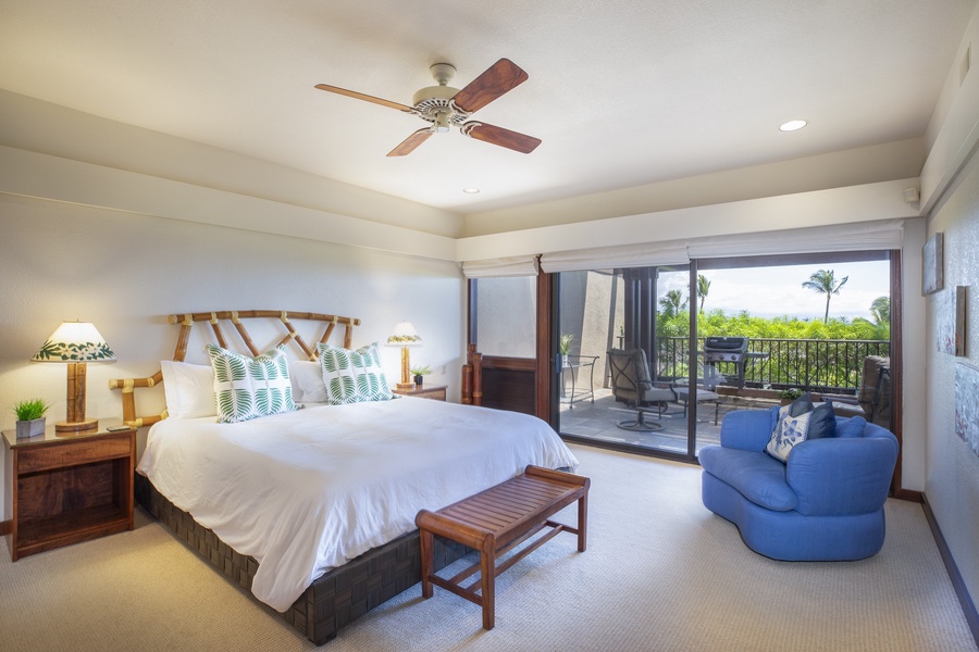 Spacious second primary bedroom with a king bed, natural light, and a private lanai.