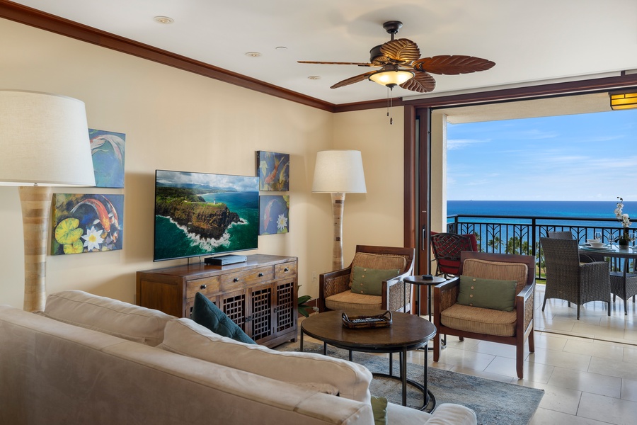 The living area has direct access to the lanai and ocean views.