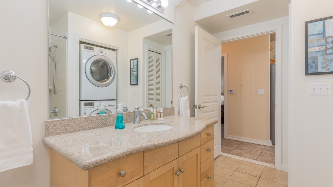 The second guest bathroom with ample lighting and beautiful vanity.
