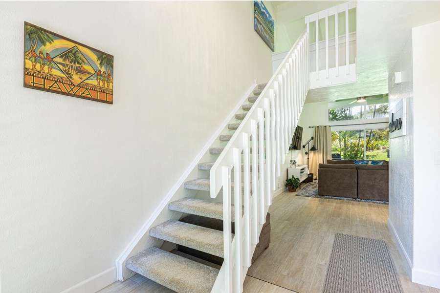 Head upstairs after a beach day and settle into restful comfort across two light-filled levels.