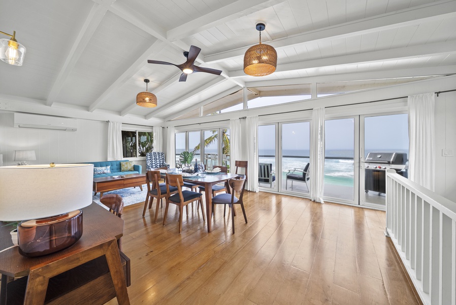 Inviting communal space with vaulted ceilings and ocean views, giving guests a true North Shore indoor–outdoor living experience.