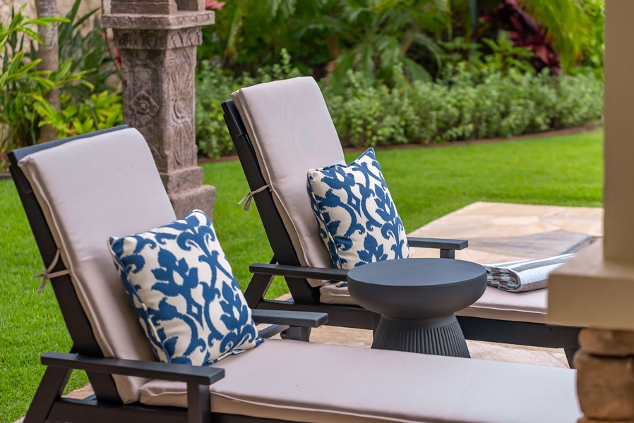 Lounge in your private garden retreat, with plush cushioned chairs and vibrant greenery surrounding you. Enjoy peaceful moments outdoors in comfort and style.