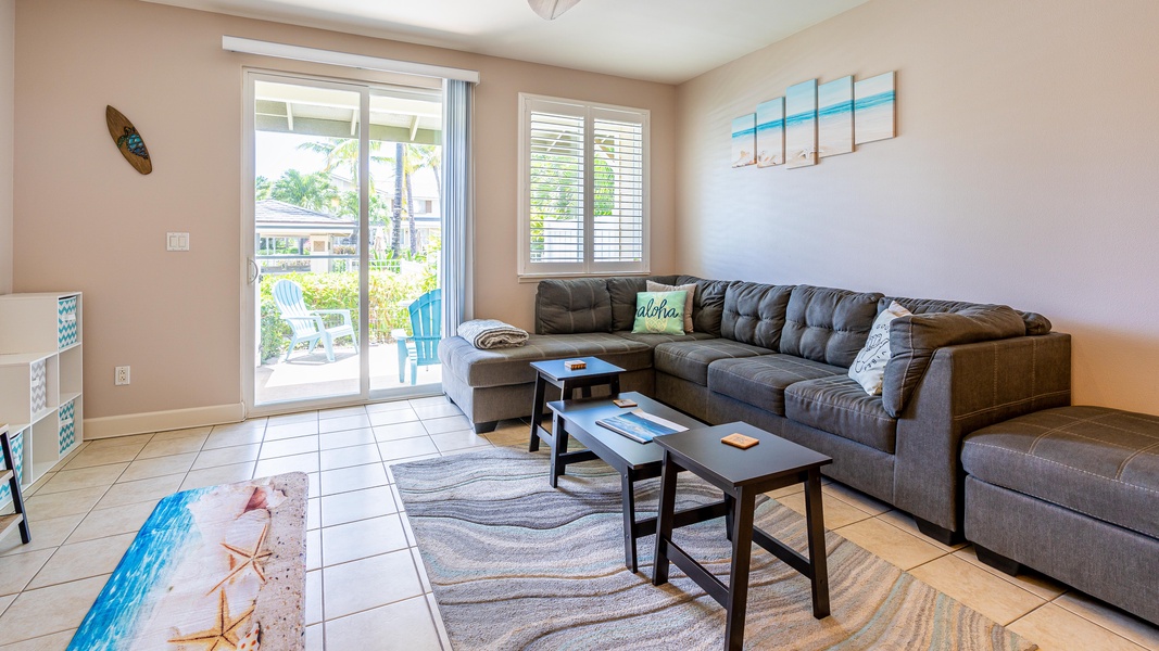 Sink into the plush seating in the living area surrounded by soft colorful decor.