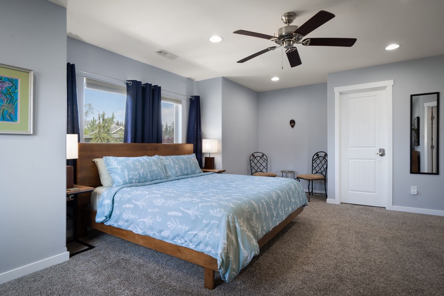 Relax in this expansive primary retreat with soft carpeting, ceiling fan, and plenty of room to settle in comfortably.