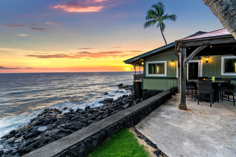 Evenings paint the home in golden light, enhancing its oceanfront beauty.