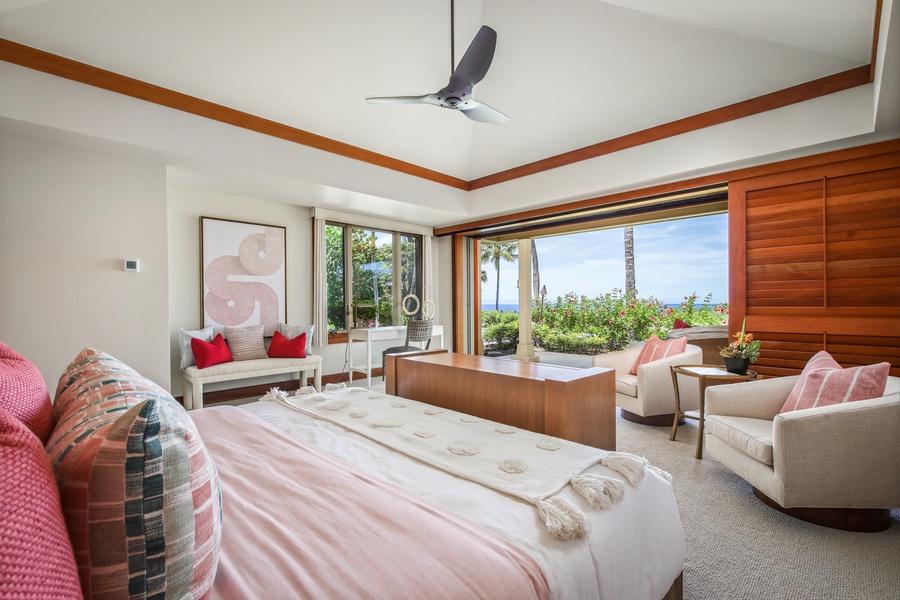 Primary bedroom suite with seating area, private lanai, en suite bath and ocean views.