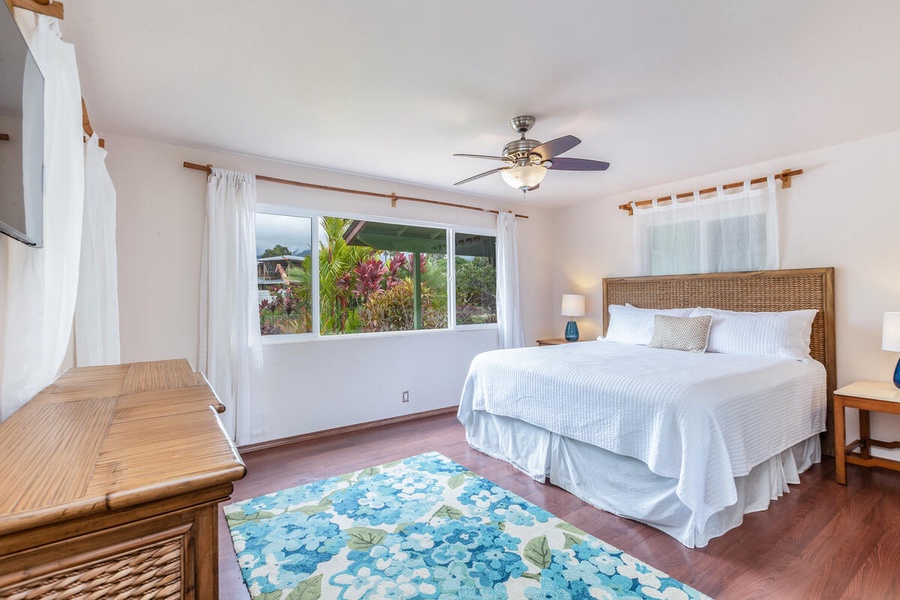 Guest Bedroom 4 boasts views of the tropical garden