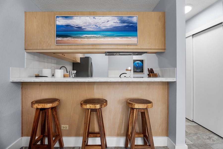 Kitchen bar with seating for three, perfect for casual dining or morning coffee.
