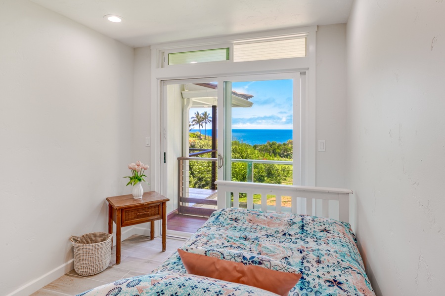 Third guest suite with a twin bed and private balcony