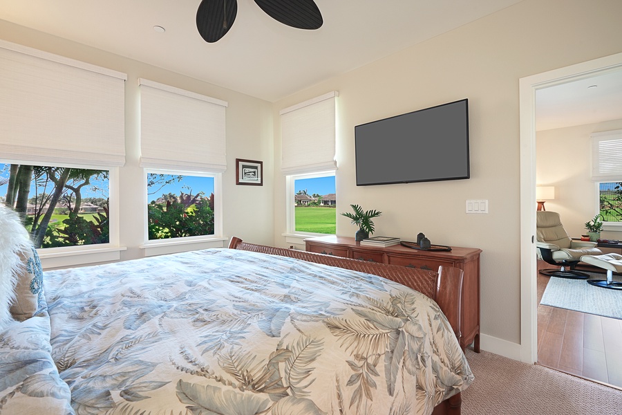 Spacious and sunlit bedroom with panoramic views, perfect for a serene retreat.
