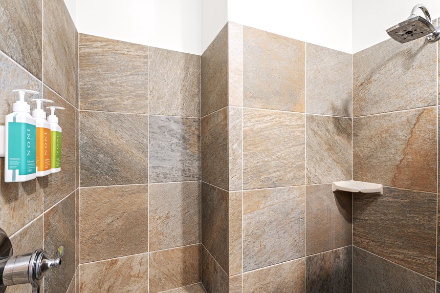 Walk-in shower with elegant tilework for a refreshing start to your day.