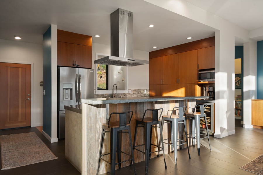 Your gourmet kitchen awaits with sleek appliances, granite counters, and a breakfast bar perfect for morning coffee or evening cocktails.