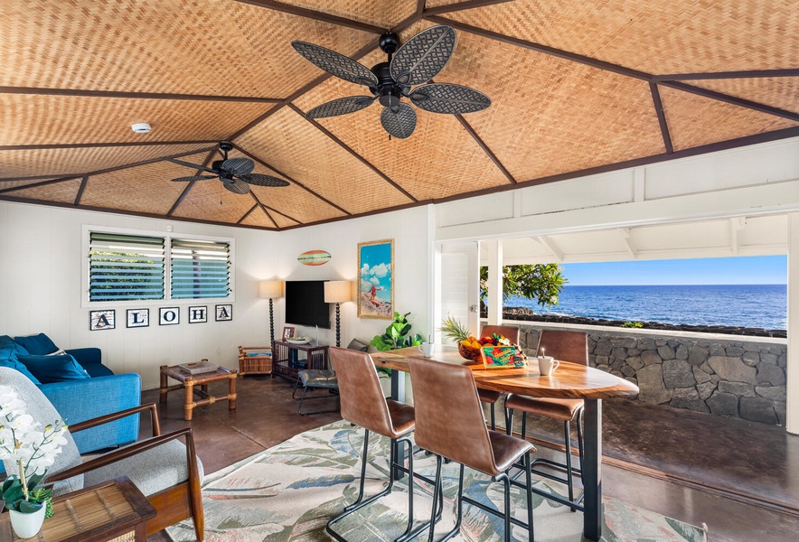 Breezy open-concept layout connecting the living and dining areas with ocean views.