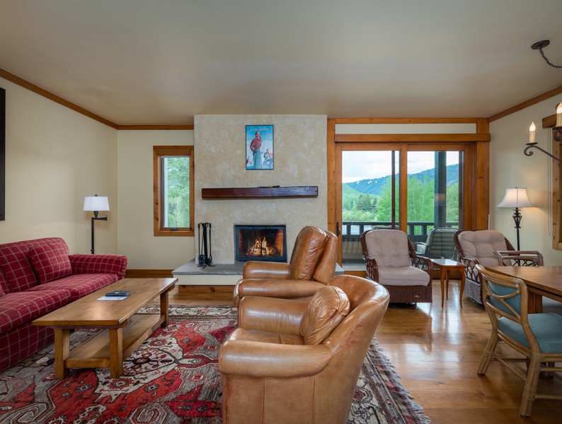 Step into pure comfort and a warm welcome as you enter the inviting living area with access to the deck