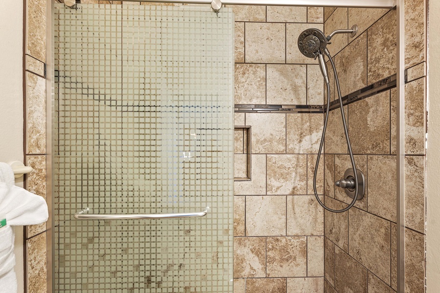 Enjoy a relaxing shower experience in this elegant walk-in shower.