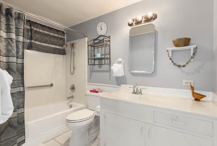Ensuite with shower/tub combo and a nice vanity space.