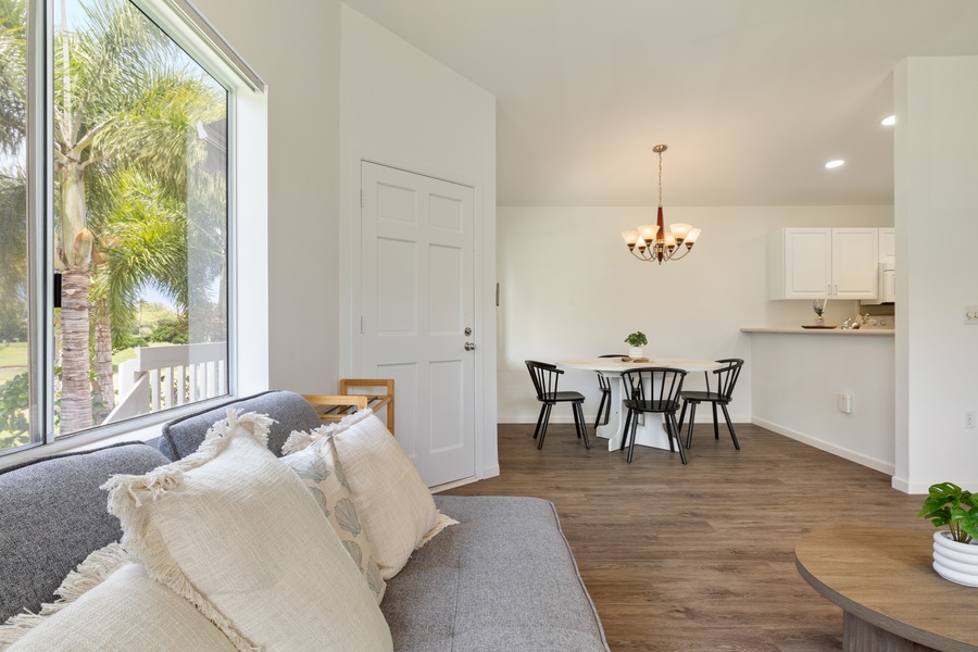 Sink into plush cushions while natural light floods your open living space, creating the perfect backdrop for memorable meals and relaxation.