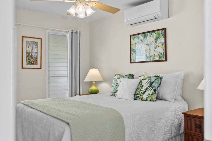 Second guest suite exuding warmth and comfort, complete with a split type AC and top-quality linens for a peaceful slumber.