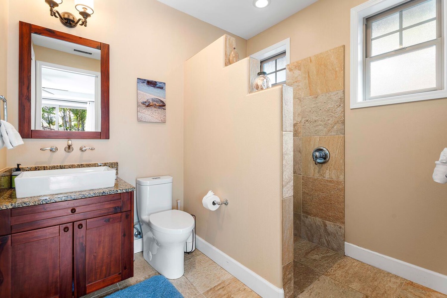 Ensuite bathroom with a walk-in shower and a single vanity.