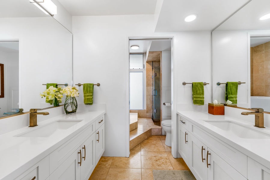 Dual vanity bathroom in the primary suite offers space and style, with elegant finishes and plenty of counter room for your daily routine.