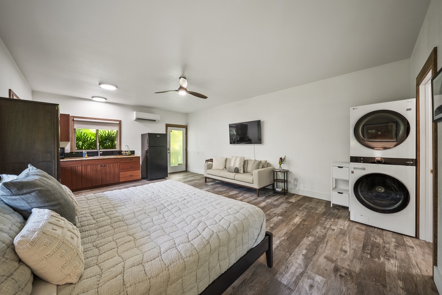 Wide view of the studio’s combined bedroom and living space—spacious and self-contained.