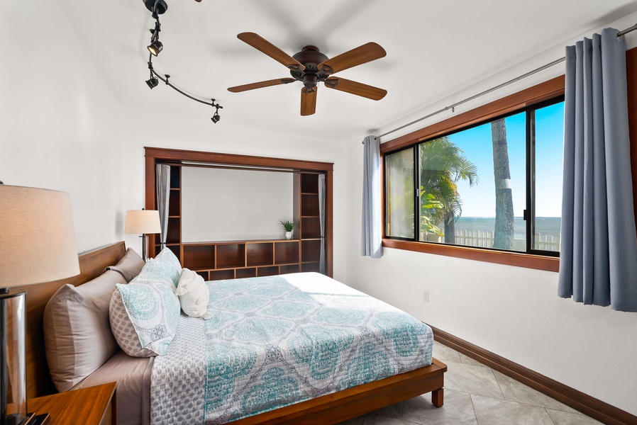 Tranquil bedroom 2 retreat with a cozy queen bed and plenty of natural light.