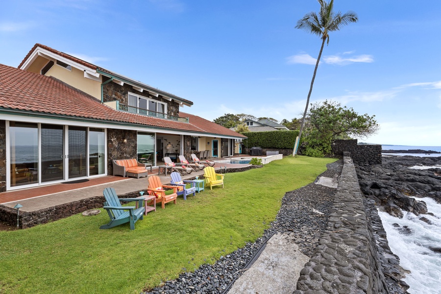 Gather on the lawn with colorful seating and wide-open ocean views.
