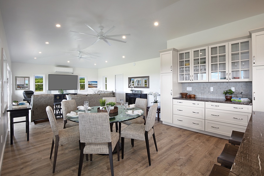 Combined living and dining area with ample space for entertaining, enhanced by stylish furnishings and a welcoming atmosphere.