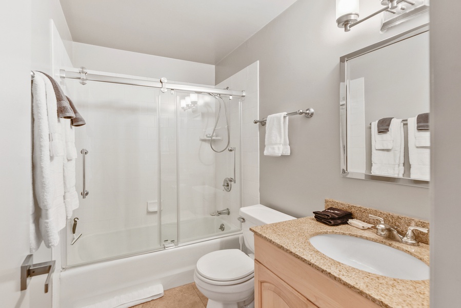Shared bath with ample vanity space.