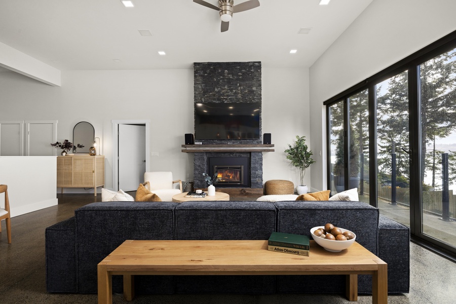 Open-concept living and dining area designed for connection, comfort, and spectacular coastal views.