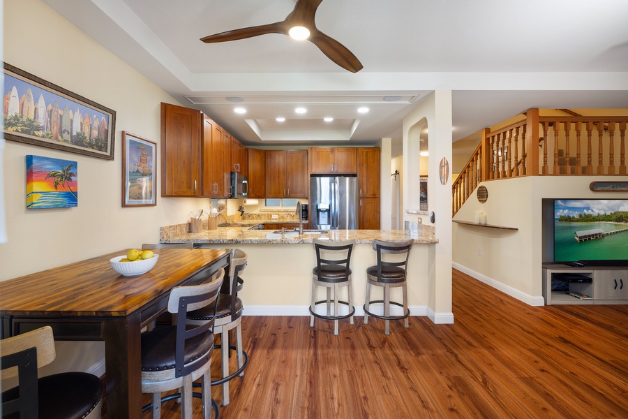 The dining area seats four, creating a cozy space for family meals and gatherings.