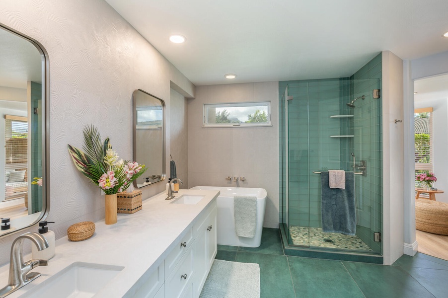 The ensuite bath with dual sinks, a soaking tub and a separate walk-in shower.