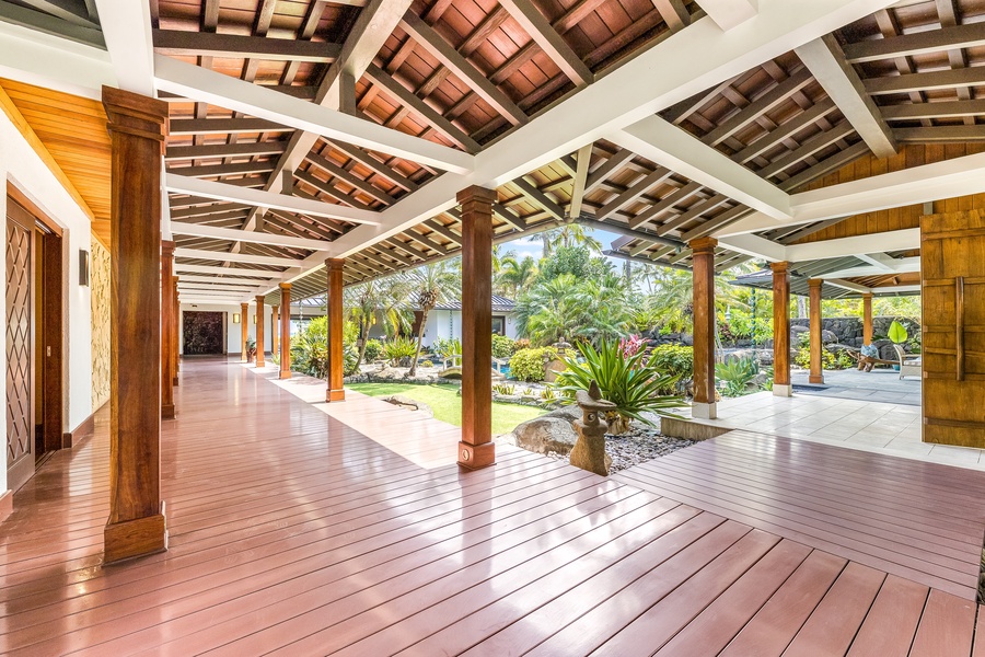 Grand covered walkways connect indoor and outdoor spaces with timeless island elegance.