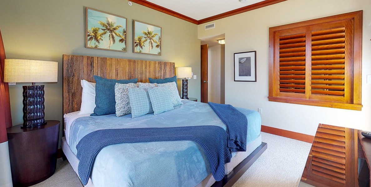 The spacious primary guest bedroom with a king bed.
