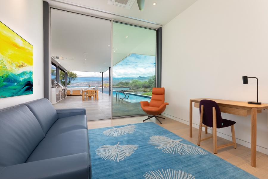 The office provides a fold out queen sleeper and dedicated workspace with views.