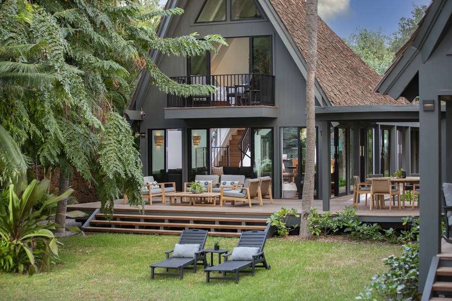 Cozy outdoor chairs with garden views.