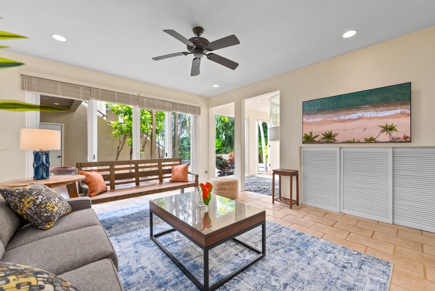 Relax in your bright media room with tropical views and coastal artwork that brings the beach indoors.