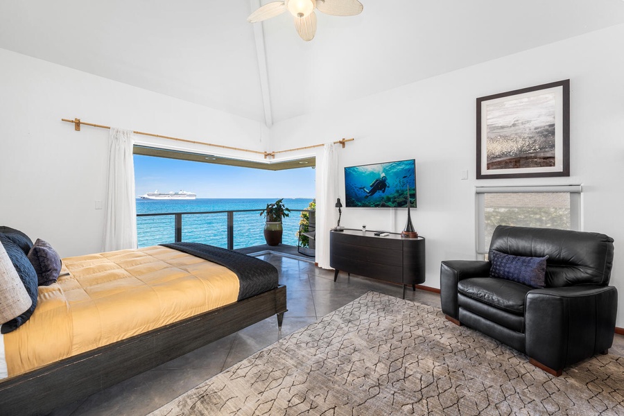 Primary suite with king bed, TV, and direct access to your private oceanview lanai.
