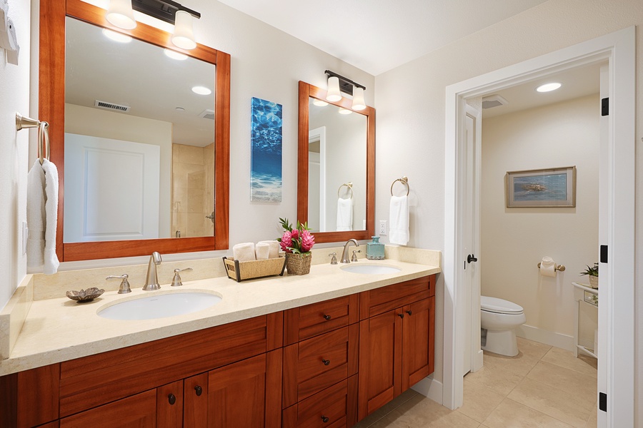 Ensuite bathroom with dual vanity and ample storage.