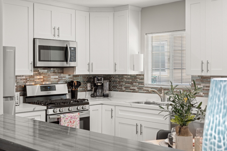 The kitchen area has expansive counter space prepping meals.