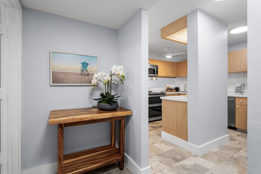 Entryway console with tasteful artwork and decorative accents.